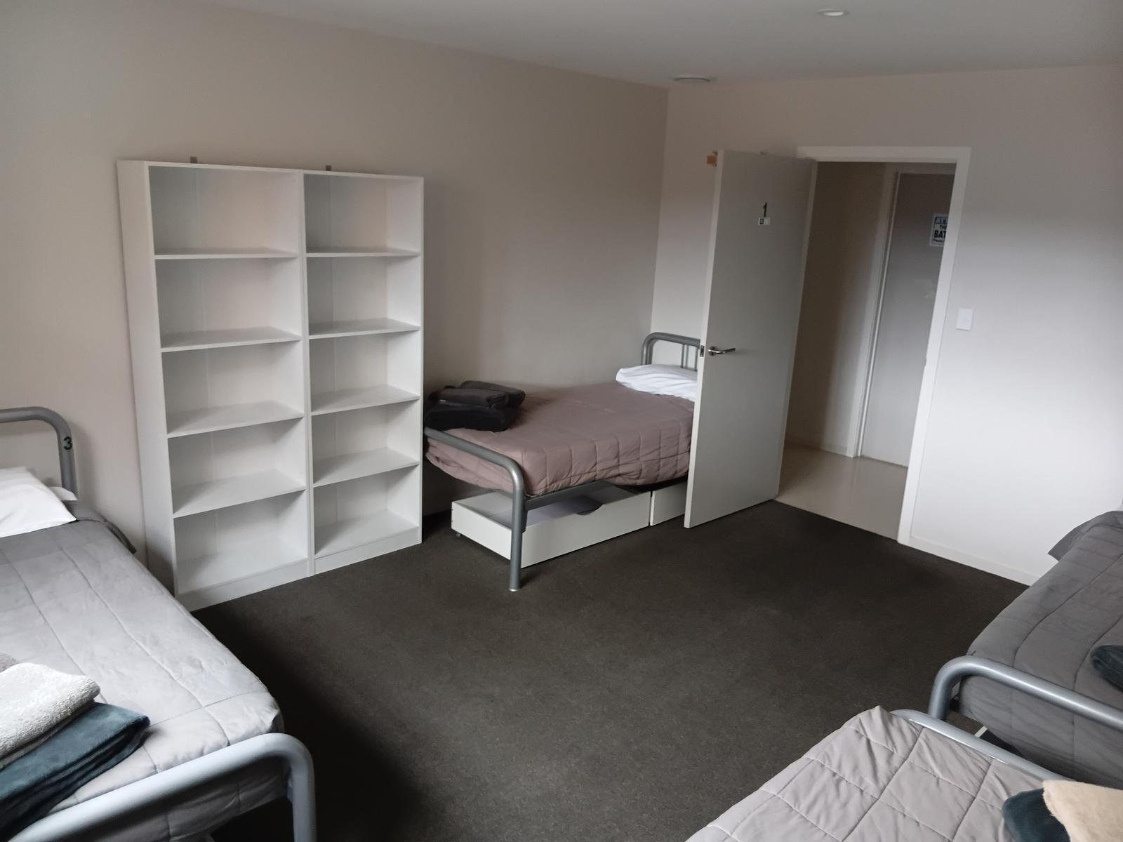 Private sleeping room with multiple beds